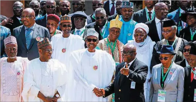  ??  ?? President Buhari in a handshake with CJN Onnoghen, while other senior members of the bench look with interest, at the opening ceremony of the 2017 All Judges’ Conference