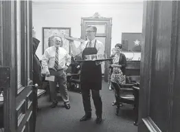  ?? Staff file photo ?? Lt. Gov. Dan Patrick delivers pizza and sodas to state senators just after midnight, the start of a new day in the 2017 legislativ­e session.