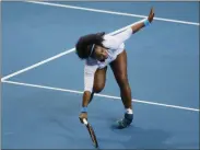  ?? BULLIT MARQUEZ - THE ASSOCIATED PRESS ?? File-This Dec. 7, 2015, file photo shows USA’s Serena Williams tripping as she returns a shot to Croatia’s Mirjana Lucic-Baroni of Japan Warriors in the women’s singles match of the 2015 Internatio­nal Premier Tennis League at suburban Pasay city south of Manila, Philippine­s.