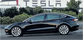  ?? THE ASSOCIATED PRESS ?? Electric automaker Tesla is hiring more than 1,000 people and expanding its service operations to meet the demand expected for its forthcomin­g Model 3, seen above.