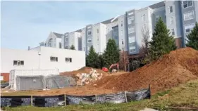  ?? STAFF PHOTO BY MIKE PARE ?? A vacant lot at 621 E. M.L. King Blvd., near UTC, shows work going on Nov. 10 for a new apartment complex. The site will hold 24 units of affordable housing.