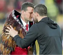  ?? ROSS GIBLIN ?? Hurricane Dane Coles and Lions skipper Sam Warburton hongi after the treasured korowai is presented.