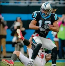  ??  ?? Carolina’s Kaelin Clay tries to break free from Tampa Bay’s Chris Conte. For the fourth time this year, the Panthers will be looking to fill the No. 2 wide receiver spot following the season-ending injury to Damiere Byrd.