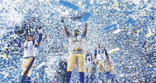  ?? NATHAN DENETTE/THE CANADIAN PRESS ?? The Winnipeg Blue Bombers celebrate after winning the 107th Grey Cup against the Hamilton Tiger Cats in Calgary in November.