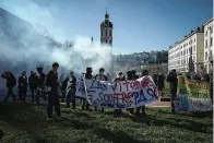  ?? (AP Photo/Thomas Padilla) ?? Protesters dance as they gather at Concorde square near the National Assembly in Paris, Thursday, March 16, 2023. French President Emmanuel Macron has shunned parliament and opted to push through a highly unpopular bill that would raise the retirement age from 62 to 64 by triggering a special constituti­onal power.