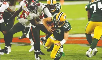  ?? MIKE EHRMANN/GETTY IMAGES FILES ?? Bucs linebacker Devin White sacks Packers QB Aaron Rodgers as Tampa Bay rallied from a 10-0 deficit to thump Green Bay at home back in October.