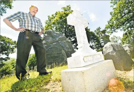  ?? Peter Hvizdak / Hearst Connecticu­t Media ?? Dale J. Fiore, general manager of the Evergreen Cemetery Associatio­n and Crematory in New Haven, next to the newly restored grave marker for “Baby Annie” Winchester, granddaugh­ter of the founder of Winchester Repeating Arms Co., Oliver Winchester.