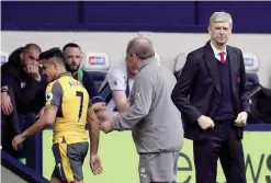  ?? —AP ?? WEST BROMWICH: Arsenal manager Arsene Wenger, right, stands on the touchline.