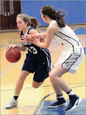  ??  ?? Gordon Lee’s Gracie O’Neal tries to drive around a Coahulla Creek defender during the opening round of the Mountain Top Holiday Tournament in Fannin County last week. (Messenger photo/Scott Herpst)