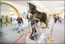  ??  ?? In this Feb 1 photo, statues and other commemorat­ive works depicting the fight with the Islamic State group, are on display in the Popular Mobilizati­onForces War Museum on al-Mutanabi Street, Baghdad, Iraq. (AP)