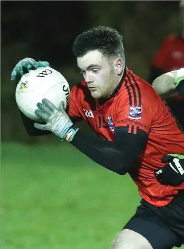  ??  ?? Michael McKeown of Mattock Rangers and Stephen Kilcoyne of Sean O’Mahonys in action on a cold night