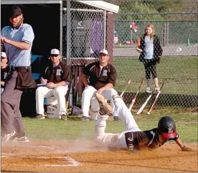  ?? MARK HUMPHREY ENTERPRISE-LEADER ?? Lincoln’s Toby Rose completes a scoring play sliding across the plate in a nonconfere­nce victory against Elkins.