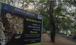  ?? RAFIQ MAQBOOL — THE ASSOCIATED PRESS ?? A warning signboard stands in Sanjay Gandhi National Park, which prohibits visitors and daily walkers from walking in the forest after 6p.m., a time considered most active for leopards, in Mumbai, India, on April 6, 2022.