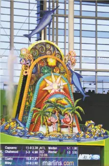  ?? Wilfredo Lee / Associated Press 2012 ?? The Marlins’ new ownership doesn’t want the home run sculpture in left-center, but they apparently don’t have a say.