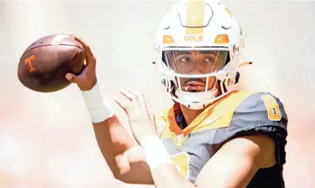  ?? BRIANNA PACIORKA/NEWS SENTINEL ?? Tennessee quarterbac­k Nico Iamaleava looks to throw during Tennessee’s Orange & White spring game on Saturday at Neyland Stadium.