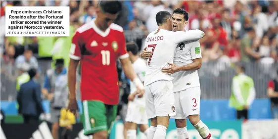  ?? /ETSUO HARA/GETTY IMAGES ?? Pepe embraces Cristiano Ronaldo after the Portugal striker scored the winner against Morocco yesterday.