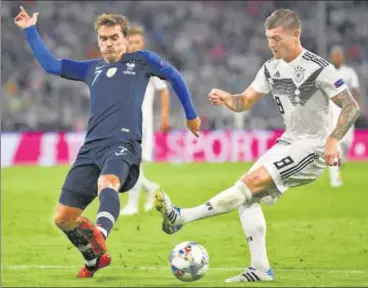  ?? REUTERS ?? France's Antoine Griezmann (left) and Germany's Toni Kroos in action during their side’s goalless draw on Thursday.