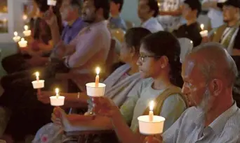  ?? ?? Paying tribute: Activists held candle lights in memory of the victims of the communal strife and called for a political solution to the crisis in Manipur on Saturday.