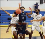  ?? OWEN MCCUE — MEDIANEWS GROUP ?? Pottstown’s Darius Smallwood (3) and Jahzeel Watson (4) and Upper Merion’s Madison Tatom (11) and Kareem Abdussamad (54) scramble for a loose ball on Friday night.