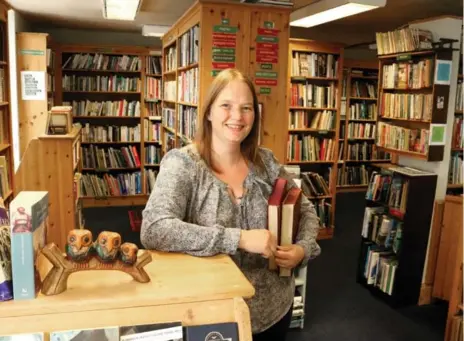  ?? DAVID BATEMAN PHOTOS ?? Ottawa anthropolo­gist Sam Evans, 47, is “filled with such joy” running Airbnb bookshop The Open Book, in Wigtown, Scotland.