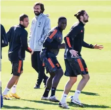  ?? — AFP photo ?? Pirlo (second left) attends the players’ training session on the eve of the UEFA Champions League group G match between Juventus and Barcelona at the Juventus Training Centre in Turin.