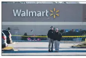  ?? BILLY SCHUERMAN / THE VIRGINIAN-PILOT VIA AP ?? Police are stationed Wednesday outside a Walmart in Chesapeake, Va., where a mass shooting took place late Tuesday.