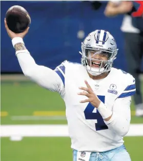  ?? MICHAEL AINSWORTH/AP ?? Cowboys quarterbac­k Dak Prescott throws a pass in the first half of a game against the Giants on Oct. 11, 2020, in Arlington, Texas.