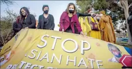  ?? Apu Gomes AFP via Getty Images ?? PROTESTERS call for an end to violence Wednesday in Garden Grove.