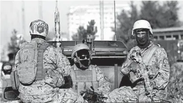  ?? RAFIQ MAQBOOL/AP ?? Afghan security forces guard an area near the site of a deadly blast Tuesday in Kabul.