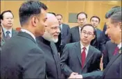  ?? PTI PHOTO ?? Prime Minister Narendra Modi and Chinese President Xi Jinping exchange greetings on the sidelines of the G20 Summit in Hamburg on Friday.