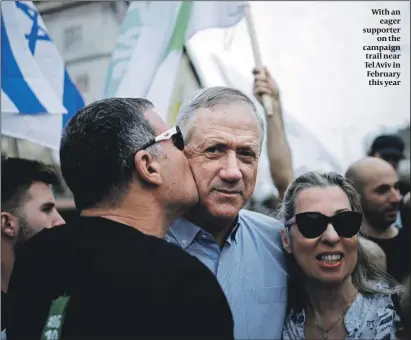  ??  ?? With an eager supporter on the campaign trail near Tel Aviv in February this year