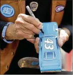  ?? MATT SLOCUM /AP ?? Richard Petty signs an autograph for a fan at a sponsor’s event during the NASCAR Cup Series Pocono 400 race weekend last month in Long Pond, Pa.