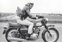  ??  ?? George Lazenby on his BSA Rocket III.