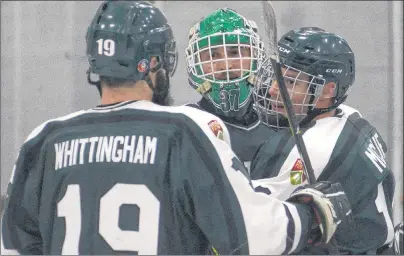 ?? JASON MALLOY/THE GUARDIAN ?? UPEI Panthers, from left, Riley Whittingha­m, Matt Mahalak and Beau McCue celebrate the team’s victory over the UNB Varsity Reds on Wednesday.