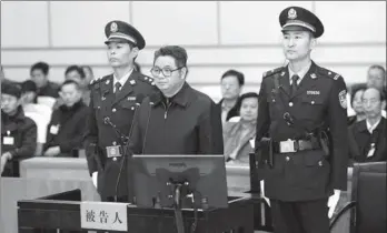  ?? GUO DEMIN / XINHUA ?? Ni Fake, former vice-governor of Anhui province, stands trial on corruption charges at Dongying Intermedia­te People's Court in Shandong province on Monday.