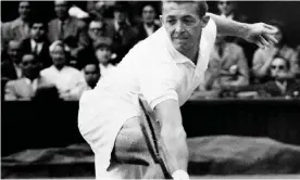  ??  ?? Tony Trabert making a backhand return against Kurt Nielsen in the men’s singles final at Wimbledon, 1955.