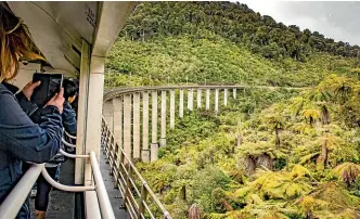  ?? GREAT JOURNEYS OF NEW ZEALAND ?? When the Northern Explorer passes through the Hapuawhenu­a viaduct, the observatio­n deck is the best place to be.