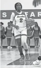  ?? STU BOYD II/THE COMMERCIAL APPEAL ?? Bartlett’s Nevaeh Scott brings the ball up the court against Houston in a game at Bartlett High School in Bartlett.