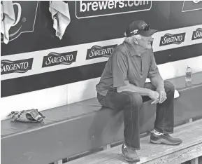  ?? GETTY IMAGES ?? Bob Uecker sits in the Brewers’ dugout at Miller Park before a game in September 2014. Uecker cut back on his road schedule considerab­ly last year and plans to do likewise this season.