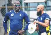  ??  ?? SA’s Amla speaks with coach Gibson (L) during a training session.