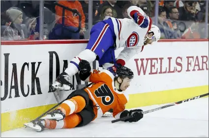  ?? MATT SLOCUM — THE ASSOCIATED PRESS ?? The Flyers’ Michael Raffl, bottom, and Montreal’s Jeff Petry collide during the second period Thursday night.