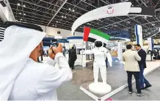  ?? Ahmed Ramzan/ Gulf News ?? A visitor takes a picture of a robot at the Government of Abu Dhabi’s pavilion at Gitex Technology Week.