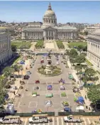  ?? NOAH BERGER/AP ?? Rectangles designed to help prevent the spread of the coronaviru­s line a city-sanctioned homeless camp in San Francisco.