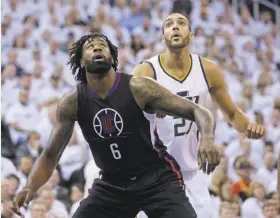  ?? Rick Bowmer / Associated Press ?? Whoever wins Sunday’s Game 7, the Warriors will face a stellar center in the second round, either L.A.’s DeAndre Jordan (6) or Utah’s Rudy Gobert (27).