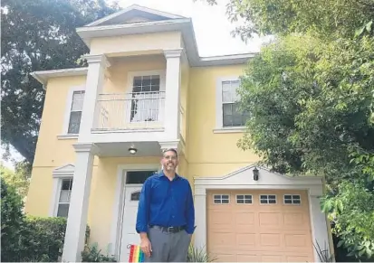  ?? BILL ZIMMERMAN/STAFF ?? David Ritland stands in front of a rental property he owns in College Park. He uses a property manager for another investment in Deltona.