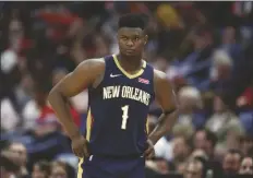  ?? ASSOCIATED PRESS ?? IN THIS MARCH 6 FILE PHOTO, New Orleans Pelicans forward Zion Williamson walks onto the court during a game against the Miami Heat in New Orleans.