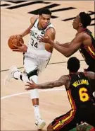  ?? Curtis Compton / Associated Press ?? Milwaukee Bucks forward Giannis Antetokoun­mpo hyperexten­ded his left knee, an MRI showed.