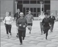  ?? THE PHILADELPH­IA INQUIRER ?? Mario Giorno, middle, and other members of the Annenberg (Lunchtime) Running Club meet three times a week at the plaza at 36th Street and Locust Walk in University City. The running club chased down a theft suspect in University City.