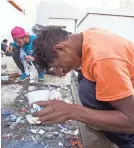  ?? OMAR ORNELAS/USA TODAY NETWORK ?? Migrants wash their faces and brush their teeth at the only water station at a shelter housing more than 5,000 people in Tijuana, Mexico.