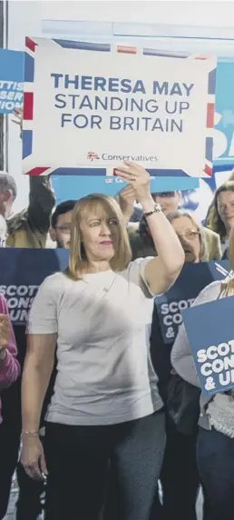  ??  ?? 0 Prime Minister Theresa May on the campaign trail at a removal firm in Edinburgh yesterday as polls put the Tories on 41.5 per cent with Labour on 40.4 per cent